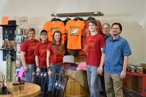 T-SHIRTS FOR THE OLD-TIME MUSIC, Ozark Heritage Festival are now available year round at Heroes Coffee Café and the Ozark Heritage Welcome Center, both in West Plains.  With the festival T-shirt display at Heroes Coffee Café are, from left Felicia Trayler, Doris Gutierrez, Mandi Rohlfsen and Bryce Mossman of Heroes and festival volunteers Mark Basom and Josh Shirley.